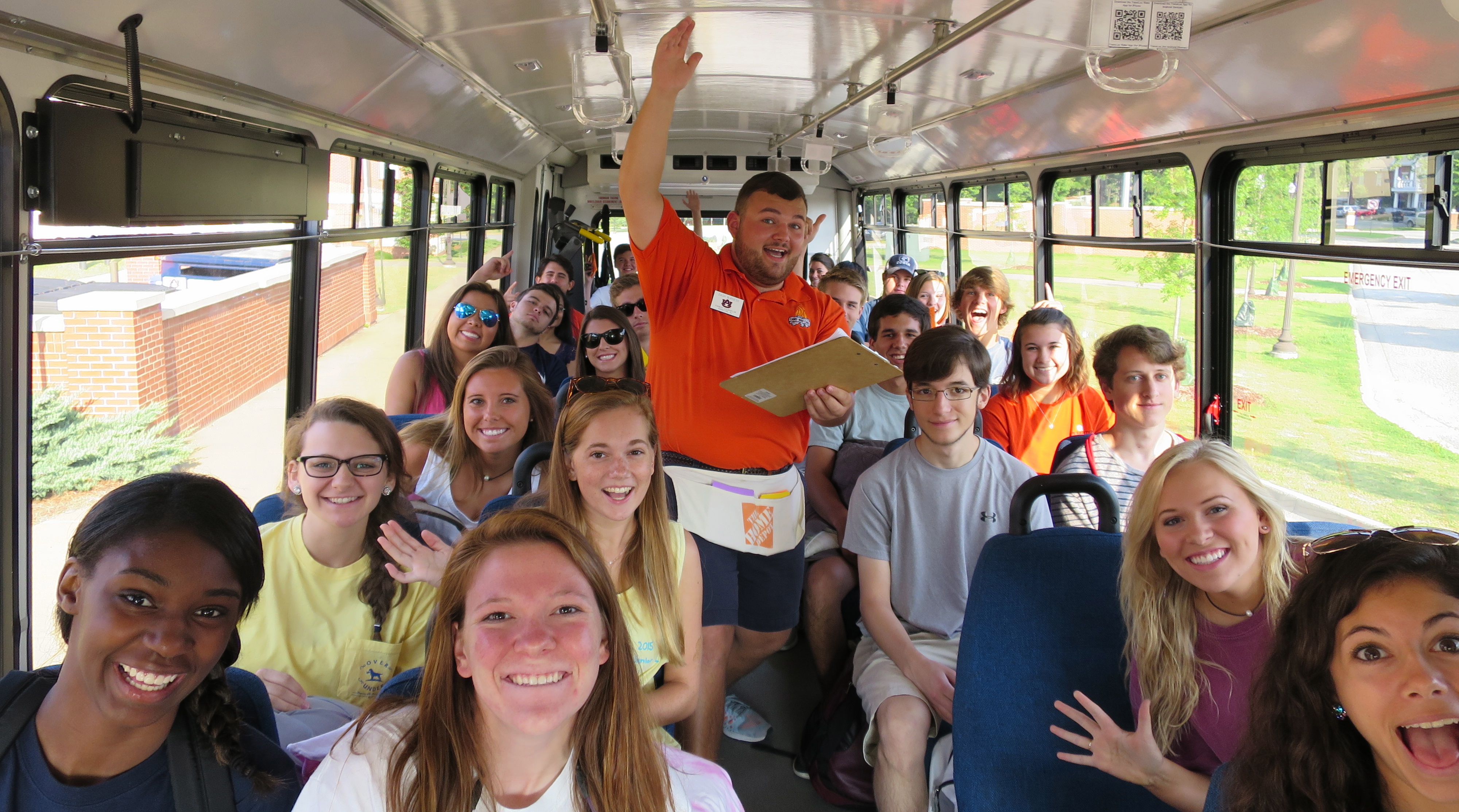 Camp War Eagle staff member in bus full of students