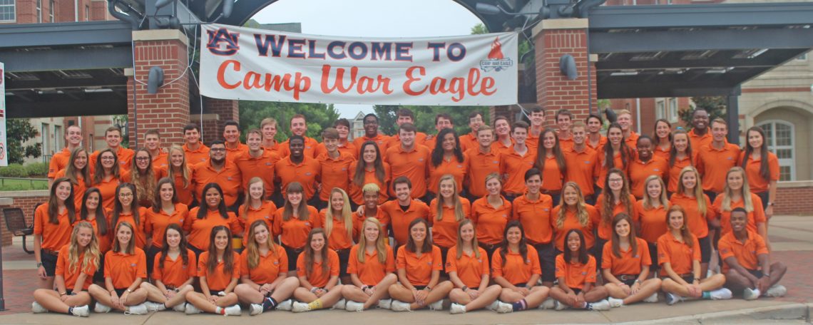 Large group of Camp War Eagle Counselors in front of Welcome to Camp War Eagle sign