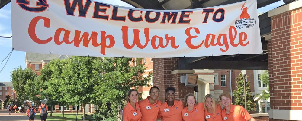 6 Counselors in front of Welcome to Camp War Eagle Banner