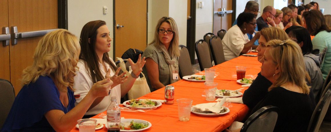 Parent Counselor talking with four mothers at lunch